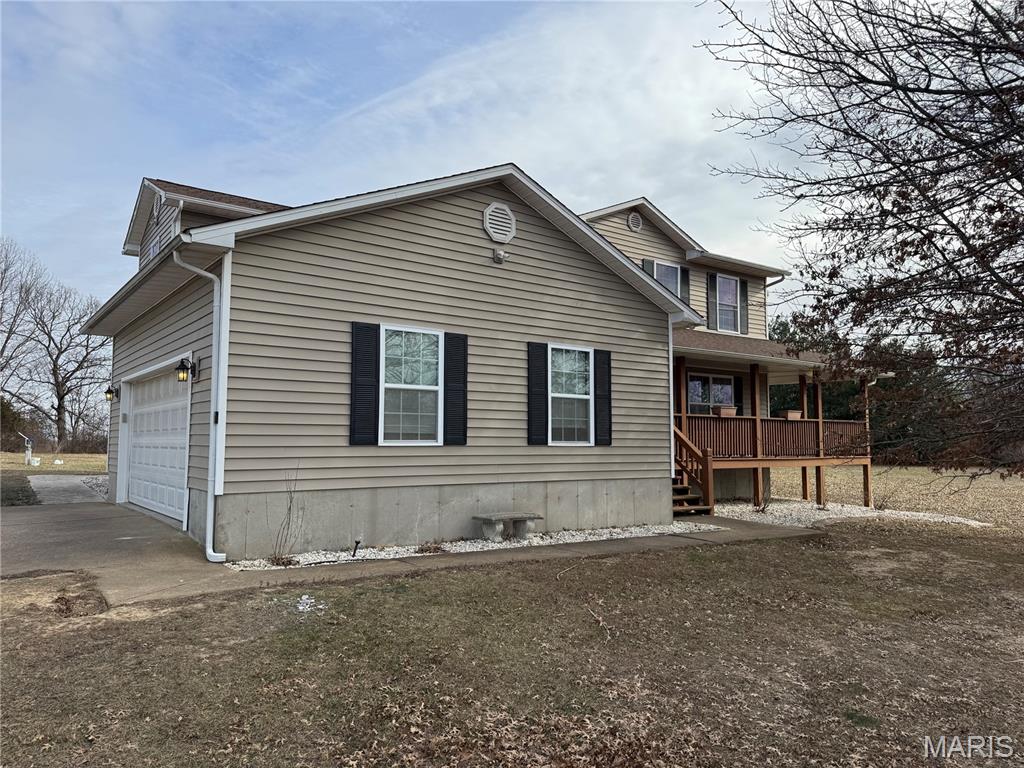 Country living at its finest!!! This is an absolute must see home for a family that wants to be in the country but minutes from town. This beautiful 5 bedroom 2.5 bath home sits on 4.5 +/- acres that is completely fenced around the entire property. Inside you will find on the main level a beautiful kitchen with granite countertops and matching backsplash. The kitchen leads right into the living/dining area where there is a wood burning stove to get cozy around during the winter months. Upstairs the house has 4 out of 5 bedrooms and both full baths. There are beautiful features throughout the home with ceramic and wood flooring, custom tile showers, backsplash and beautiful views. A huge bonus is the 30x40 shop and apartment that sits just across the driveway. Full electric in the whole building and the apartment gives you so many options, mother in law quarters, rental income, older children, it can fit so many different scenarios. This really is a must see home so schedule your appointment.