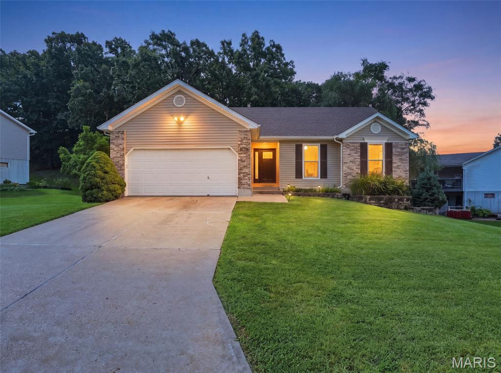 PRIDE OF OWNERSHIP shines through in this inviting ranch featuring an open floor plan, vaulted ceiling and a warm wood-burning fireplace that creates the perfect gathering space. The main level offers 3 bedrooms and 2 full baths, providing comfortable one-level living. Primary bedroom with The walk-out lower level expands the living space with a beautifully finished recreation area, built-in bookshelves and an electric fireplace. A flexible bonus room offers endless possibilities as an optional 4th bedroom, home office, craft room or hobby space. Step outside to the deck and take in the peaceful, retreat-like backyard. With a firepit and a backdrop of mature trees, this private setting is perfect for morning coffee, entertaining friends or relaxing around the fire in the evening. A wonderful combination of comfortable living spaces, flexible finished lower-level space and a serene backyard setting—this is a home you’ll want to make your own.
