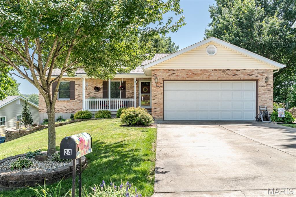 This is IT!!  A remarkable ranch, with park-like backyard, has been lovingly maintained and updated and is now ready for a new owner to enjoy all the space, both inside and out!  Step inside to the inviting living room showcasing the gorgeous fireplace, flanked by windows, which brings lots of natural light to highlight the warm engineered wood flooring while the bright dining area is perfect for great meals and exits to the maintenance free deck.  What a convenient workplan in the updated kitchen featuring custom soft-close cabinetry with the top cabinets offering lighted glass-fronts, solid surface countertops, pantry plus all appliances are included...ready for the cook of the family to love!  Three nice-sized bedrooms gives everyone plenty of room to call their own and includes the primary with ensuite bath and large closet space!  Check out the lower level where you can entertain guests or just relax!!  Whether you want to play pool, watch movies in the sitting area or play cards and make use of the extra kitchenette found here, too, this is such a versatile space to enjoy!  The lower level could easily be used as an in-law quarters as there's also a full bath!  You'll fall in love with the tranquil setting of the backyard where you can relax on the covered patio, barbecue on the deck or just enjoy the gorgeous landscaped yard with mature trees AND a view of the neighboring lake!  A workshop area, main floor laundry and oversized garage completes the home.  Located close to shopping and restaurants, you're minutes away from all of the amenities that Washington has to offer!  This immaculate home will make you feel right at home!!  Make it YOURS today!!  **Pool table can remain with home**