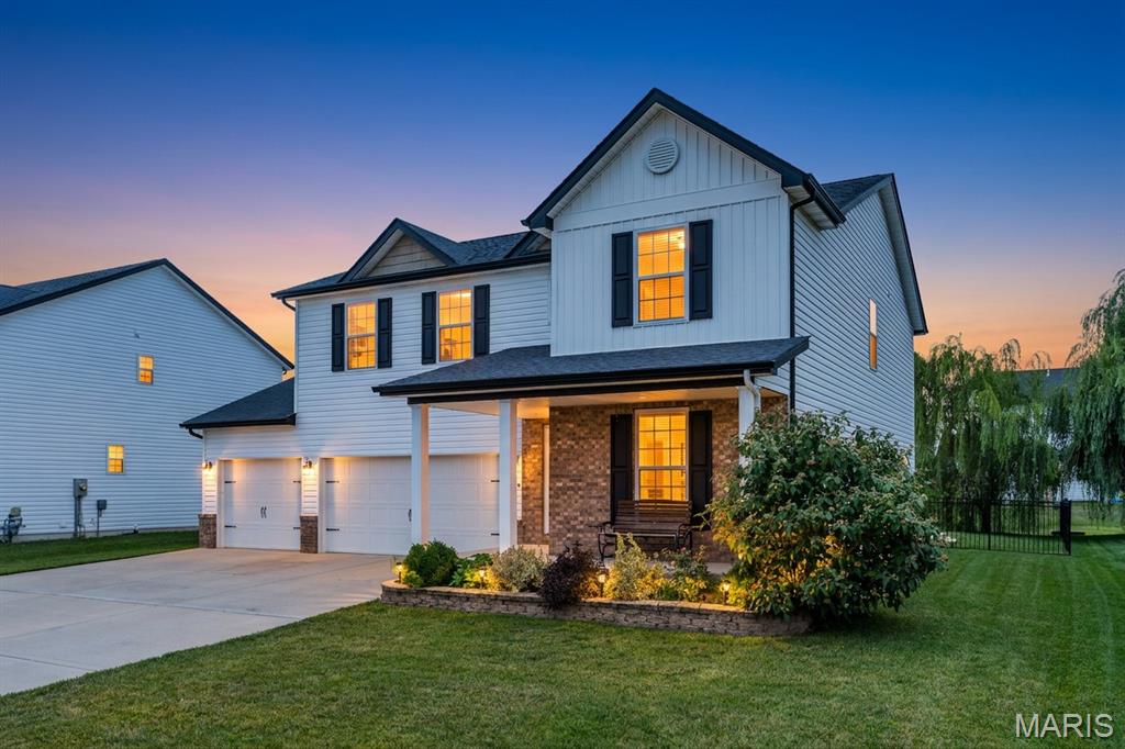 Move-in ready and only six years young, this 2020-built two-story in Indian Springs sits just minutes from Scott AFB with five bedrooms, three and a half baths, and 3,222 finished square feet across three levels. If you have been waiting for a home that is genuinely done, this is it.

Step through the two-story foyer and the open floor plan does what you hoped it would. The family room, anchored by a stone gas fireplace, opens straight into the dining area and a kitchen built for people who actually cook: granite countertops, a large kitchen island with seating, a gas range, stainless appliances, and a walk-in pantry that holds everything. Cooking, homework and conversation all happen in the same space instead of three different rooms. Off the entry, a second living room nearly twenty-eight feet long gives you somewhere quieter to land, so the house works whether you are hosting fifteen people or hiding from all of them.

Upstairs, four bedrooms surround a generous loft that makes a perfect home office, playroom or second lounge, overlooking the foyer below. The primary suite is a true retreat at nearly twenty feet wide, with a walk-in closet, double vanity, and a separate soaking tub and glass shower. And the laundry is on the second floor, right where the clothes already are, which is the kind of detail you appreciate every single week.

The finished basement is where this floor plan pulls ahead of everything else in its price range. A fifth bedroom with a full-size egress window, a full bath with a walk-in glass shower, and an enormous recreation room combine into a genuine in-law or guest suite. Visiting family, a returning college student, a live-in parent, or simply the movie room you have always wanted: it is a separate living space, not a finished corner.

Outside is not an afterthought either. A covered front porch made for evenings, a covered composite deck off the kitchen, and an expansive stamped concrete patio that curves out into a fully fenced backyard with black ornamental fencing, mature landscaping and raised garden beds. Add the three-car garage and the extended concrete driveway, and there is finally room for the vehicles, the tools and the toys.

Now the part that sets it apart. The 10.44 kW solar system is OWNED, not leased, and the sellers are paying it off in full at closing, so there is no lease to assume, no payment to take over, and no lender hurdle. The lower utility bills simply come with the house. Radon was tested and professionally mitigated, and that system carries a warranty that transfers to you. Add high efficiency natural gas heat, brand new carpet on upper level, a smart lock and security system, and this is a home where the work is already done.

Indian Springs is a quiet, sidewalk-lined neighborhood in Shiloh Village District 85 feeding O'Fallon High, with an easy run to Scott AFB, Interstate 64 and everything Shiloh and O'Fallon have to offer. HOA is just $250 a year.

Vacant and ready for a quick close. Schedule your private tour today, because homes like this one do not sit.