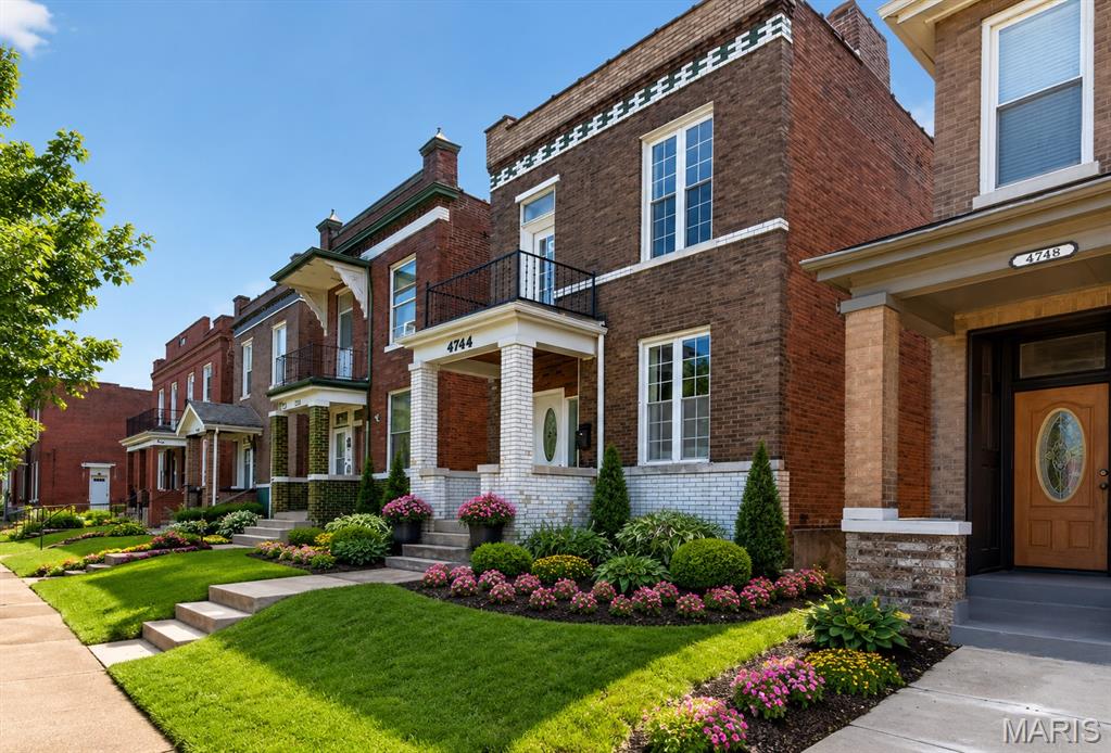 Renovated and move-in ready, this charming 2-story brick home offers the perfect blend of classic character and modern updates. Filled with natural light, the thoughtfully designed floor plan features a spacious living room that flows seamlessly into the formal dining room, ideal for entertaining, family gatherings, and everyday living. The stunning new kitchen is sure to impress with tall white cabinetry, granite countertops, stainless steel appliances (including refrigerator), a new sink and faucet, and plenty of workspace for cooking and hosting. Fresh finishes throughout make this home truly turnkey. Upstairs, you'll find a spacious primary bedroom along with two additional bedrooms, including one with access to a private balcony. Two beautifully updated full bathrooms feature new vanities, toilets, fixtures, tub/shower surrounds, and stylish tile finishes. Additional improvements include new flooring throughout, fresh interior paint, a new balcony door, updated lighting and ceiling fan fixtures, six-panel doors, and decorative fireplace accents that add warmth and character. The walk-out lower level offers abundant storage space and potential for future expansion. Outside, enjoy a level fenced backyard with convenient off-street parking and rear parking pads. Whether you're a first-time buyer or simply looking for a home where all the work has already been done, this beautifully updated property offers affordable city living at its best. Conveniently located near parks, restaurants, shopping, and major highways. Schedule your private tour today!