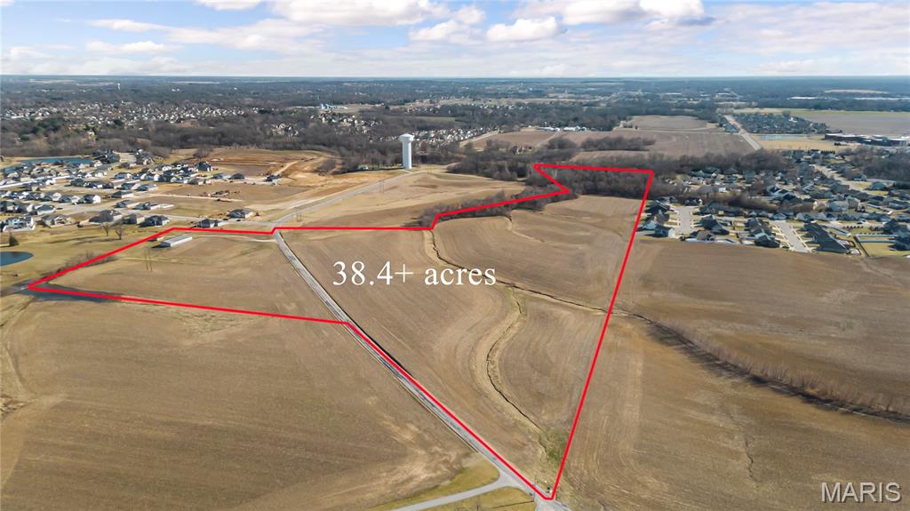 Beautiful property, great location, huge potential!  These 39.72 +/- acres are in the Heart of O’Fallon, IL! Additional parcel (MLS #25013264) with approx. 6.65 +/- acres available for purchase, too. Acreage is approximate. The property has all public utilities available near the property line.  Additional amenity is an outdoor Morton Building ideal for storage or workspace.  Currently zoned A-Agricultural in St. Clair County.  Owner has rights to all crops in field. O'Fallon School District, downtown, highway access and so much more...grab this before it is gone!