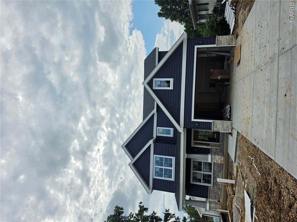 New Construction, 2-story, 5 bedroom, 3.5 bath by Schindler Homes LLC in Kirkwood. This beautiful home features 9' first floor ceilings, hardwood flooring entire 1st floor, wainscot trim in den, stainless steel Kitchen-Aid appliances with chimney hood, 42 inch shaker kitchen wall cabinets with soft close drawers and doors, pull out trash cabinet, under cabinet lighting with light rail, walk-in pantry, quartz countertops, mudroom on 1st floor with custom lockers, fireplace in family room, luxurious master bath with double sinks, Moen plumbing fixtures, separate tub and shower, his and hers large walk-in closets, large 2nd floor laundry with cabinets/granite folding counter, 50 gallon hot water heater, cased out windows, tall pour and finished lower level, and architectural grade shingles. Will have fully sodded yard and professionally landscaped. Great location, convenient to highways, parks, and shopping. Projected late July/August finish date.