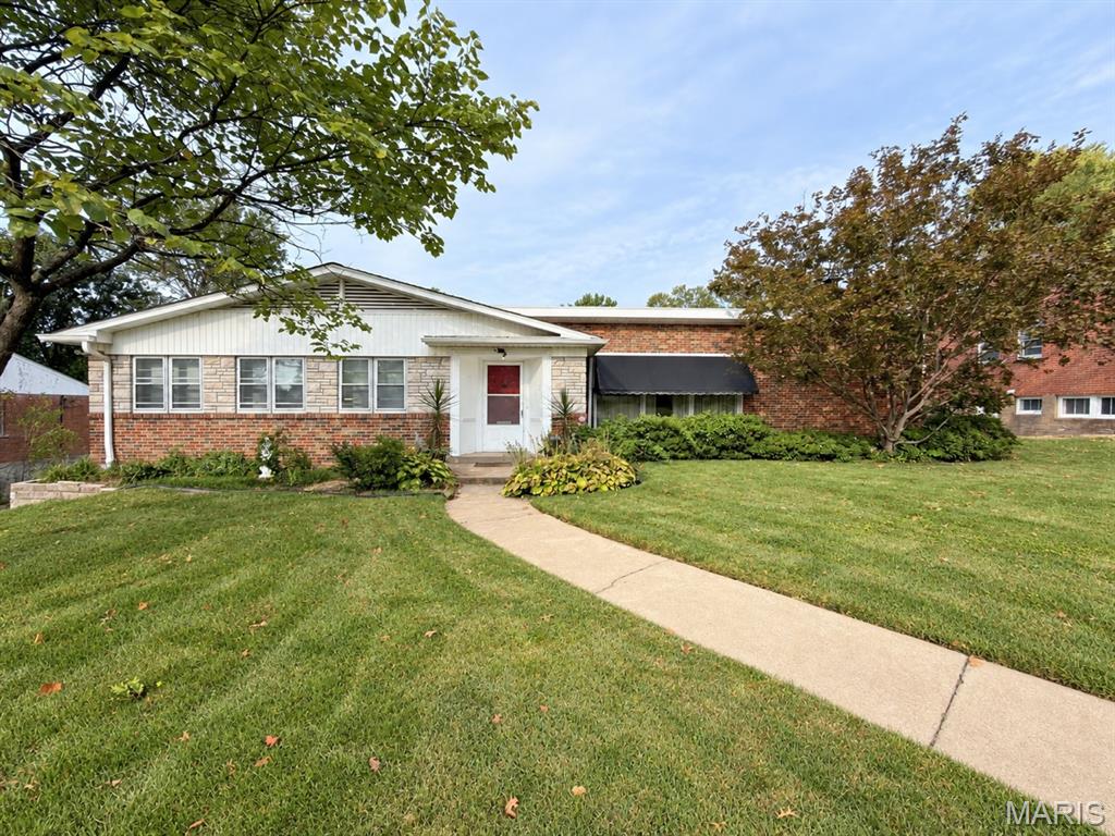 Welcome to 8250 Tulane Ave, ideally located in University City just a short walk from Ruth Park Golf Course and minutes from Highway 40/64, I-170, the Saint Louis Galleria, shopping, dining, and entertainment. This beautifully maintained 3-bedroom, 2.5-bath home features a spacious open floor plan with vaulted ceilings, a large living and dining area overlooking the landscaped backyard, and an additional family room with a cozy gas fireplace and large windows. The kitchen offers a picture window with views of the manicured outdoor space, while all three bedrooms provide generous space and ample closets. Additional features include an oversized hall tub, a spacious primary bedroom, a two-car garage, abundant storage, mature landscaping, and a wonderful backyard. With an excellent location, comfortable layout, and plenty of desirable features, this is a home you won’t want to miss!