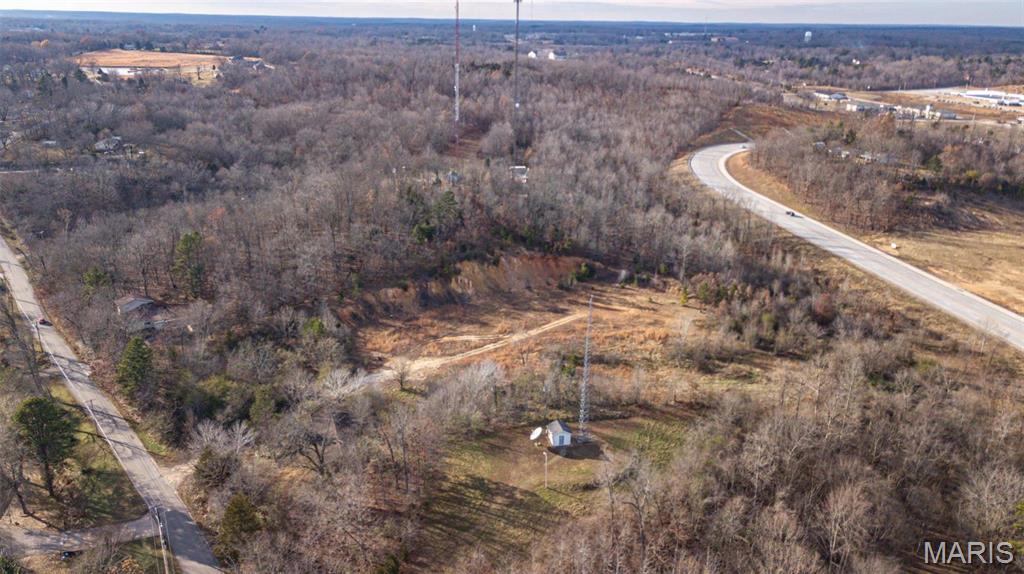 $450,000, 2579 Roxie Road Poplar Bluff MO. Lot E, B, & C are being sold together, and total 17.74 Acres M/L.  All lots are mostly wooded with guide wire easements on property. Lots accessed off of Shelby & Roxie Roads. Location: High Traffic