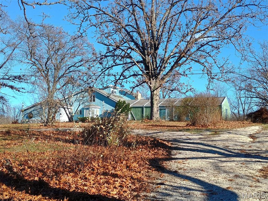 5 Bedroom 4.5 bath Residential Home on 13.20 acres m/l and has two ponds and at one time was reported stocked with bass. County Road frontage just on the north outskirts of Salem. Home has a inground pool (reported 3 foot to 12 & 1/2 foot with diving board, with a roof that opens and closes and had beautiful area for plants.  Kitchen area has dishwasher, food disposal, built in convection oven, refrigerator, Jenn-air Electric stove, slate floor in kitchen, two air conditioners, 3 electric furnaces and a wood burning fireplace. Has marketable timber on this property and has no known restrictions on it. 
Being sold "AS IS" condition. By appointment only.