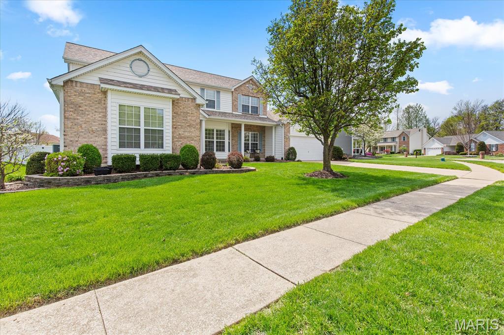 Great Location, Incredible Floor Plan, Amazing Finished Lower Level, Covered Patio and more  - must-see home! This Spacious 1.5 Story with approx. 3400 sq feet of living space offers: Main Level with, Living Room, Formal Dining Area, Great Room with Gas Fireplace, (all featuring hardwood flooring) Open & Bright Breakfast Room - Kitchen Area boasting incredible Cabinet & Granite Counter Space, Center Island, Pantry & More, Main Floor Laundry, 1/2 Bath, Spacious Primary Bedroom Suite w/ Large Walk-in Closets, Primary  Bath featuring Adult Height Double Sink Vanity, Walk-in Shower, all on the Main Level. Upper Level - just as impressive w/ 3 additional spacious Bedrooms, and additional Full Hall Bath. Finished Lower Level separates this home from the competition featuring a Spacious Family Room, Game Room, 1/2 Bath, and still plenty of storage! Oversized 2 Car Garage, Private Yard Fenced with Vinyl Privacy Fence and an awesome covered Patio Space to relax or entertain! BONUS attached outdoor storage worth a close look!