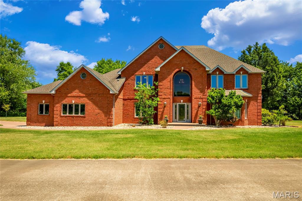 Experience the perfect blend of space, privacy, and convenience with this stunning 4,000-square-foot plus, two-story all-brick home situated on 10.8 beautiful acres. Featuring 5 spacious bedrooms and 6 bathrooms, this exceptional property is designed for comfort and functionality, with each bedroom offering its own private bathroom-ideal for family living and hosting guests. The main level includes a spacious primary suite and laundry room for added convenience. Throughout the home, you'll find timeless oak and tile flooring, creating warmth and durability in every room. The kitchen is a chef's dream, equipped with newly installed ovens, making meal preparation and entertaining a breeze. Outside, the property offers outstanding amenities, including a 2-car attached garage, a 3-car detached garage, and a paved driveway. Relax and unwind on the beautiful patio overlooking the grounds, complete with a charming stone firepit perfect for gatherings year-round. Nature lovers will appreciate the fully stocked pond featuring catfish, bluegill, and crappie, providing fishing opportunities right in your front yard. The home's recently updated roof (November 2025) and approximately 10-year-old windows add peace of mind for years to come. Conveniently located just minutes from Rend Lake, you'll enjoy easy access to camping, golfing, boating, bike trails, walking paths, and countless outdoor recreational activities. The property is also located near Interstate 57, providing quick northbound and southbound travel, while everyday essentials are just a minute away at Dollar General. Whether you're looking for a private country retreat, a place to entertain, or room to grow, this remarkable property offers it all.