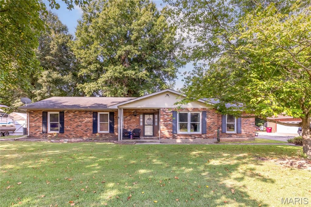 Welcome home to this charming 3-bedroom, 2-bathroom ranch! This inviting home offers a comfortable layout with a dedicated dining room plus additional flexible living space that could easily serve as a second living room, home office, playroom, or whatever fits your lifestyle! 
Step outside and enjoy the spacious backyard, compete with raised wooden garden beds - perfect for growing your own vegetables, flowers, or herbs.  The back porch creates an ideal spot to unwind, and the hot tub makes it even easier to relax and enjoy your outdoor space.
With plenty of room inside and out, this home offers the comfort, flexibility, and backyard space you've been looking for.