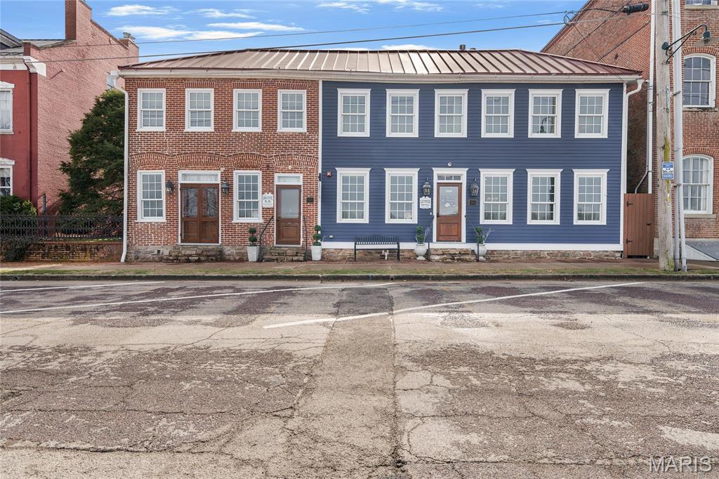 Exceptional Opportunity in the heart of historic Hermann, Missouri Wine Country! Welcome to a truly stunning, two-building, 9-room inn overlooking the beautiful Missouri River. Bursting with character and architectural charm, this meticulously maintained property blends rich history with modern luxury. Completely remodeled in 2017 and maintained with incredible attention to detail, this turnkey investment is straight out of a magazine. Each thoughtfully designed suite features a private luxury bath and kitchenette, creating an upscale and comfortable experience guests love for their weekend getaways. The property includes a separate carriage house and smokehouse, adding both charm and versatility. Guests gather in the inviting courtyard with outdoor seating and a cozy firepit --the perfect setting to unwind after a day exploring wine country. Located just two blocks from the Amtrak train station and within walking distance to local wineries, shops, restaurants, and favorites like Tin Mill Brewery, the location simply cannot be beat. Sold fully furnished -- including the real estate, furniture, and established business -- this is a rare opportunity to own a thriving, turnkey operation in one of Missouri's most sought-after destinations. Profit and Loss statements are available to qualified buyers with a signed NDA. If you've been dreaming of owning a premier inn in wine country with river views, history, and proven income potential -- this is it.