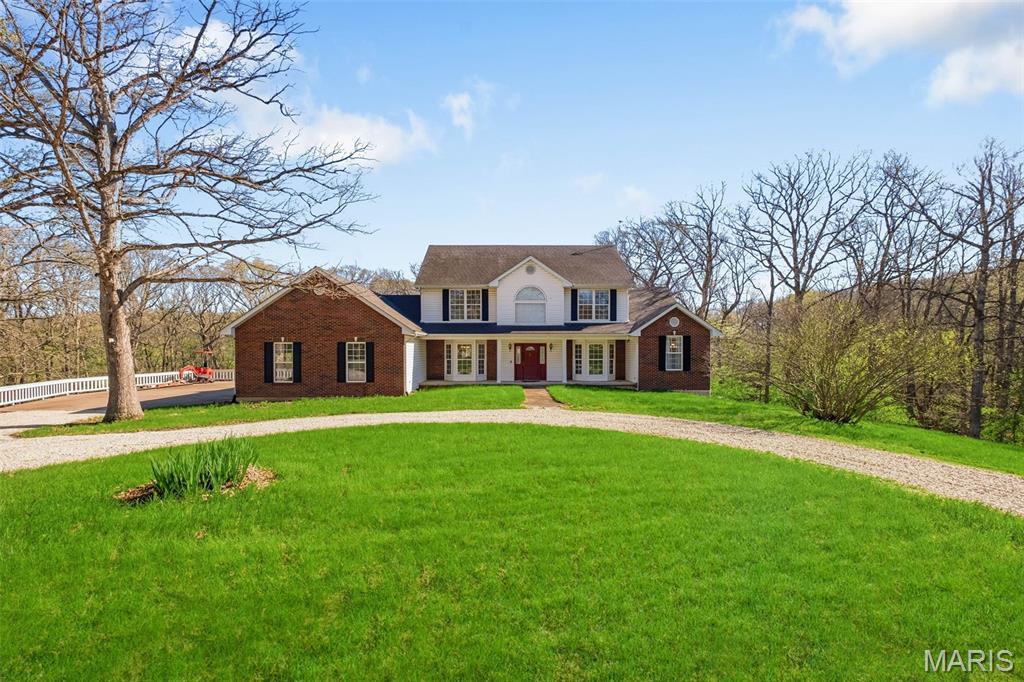 Tucked away at the back of Briarwood Subdivision, this stunning 4-bedroom, 3.5-bath home offers the perfect blend of privacy, space, and charm on 9 beautiful acres. A long, picturesque driveway welcomes you in, setting the tone for the peaceful setting that surrounds the property—complete with a sprawling backyard and a mix of open ground and wooded areas.
Inside, you’re greeted by an inviting foyer featuring a classic center stairwell. The main level boasts a spacious layout including a large kitchen with  white cabinetry, a formal dining room, a dedicated office space, and a generously sized master suite complete with its own cozy fireplace.
Upstairs, you’ll find three additional bedrooms along with an expansive living area—perfect for a second family room, play space, or entertainment zone.
With its combination of acreage, thoughtful layout, and quiet subdivision location, this property offers the best of both comfort and country living.
