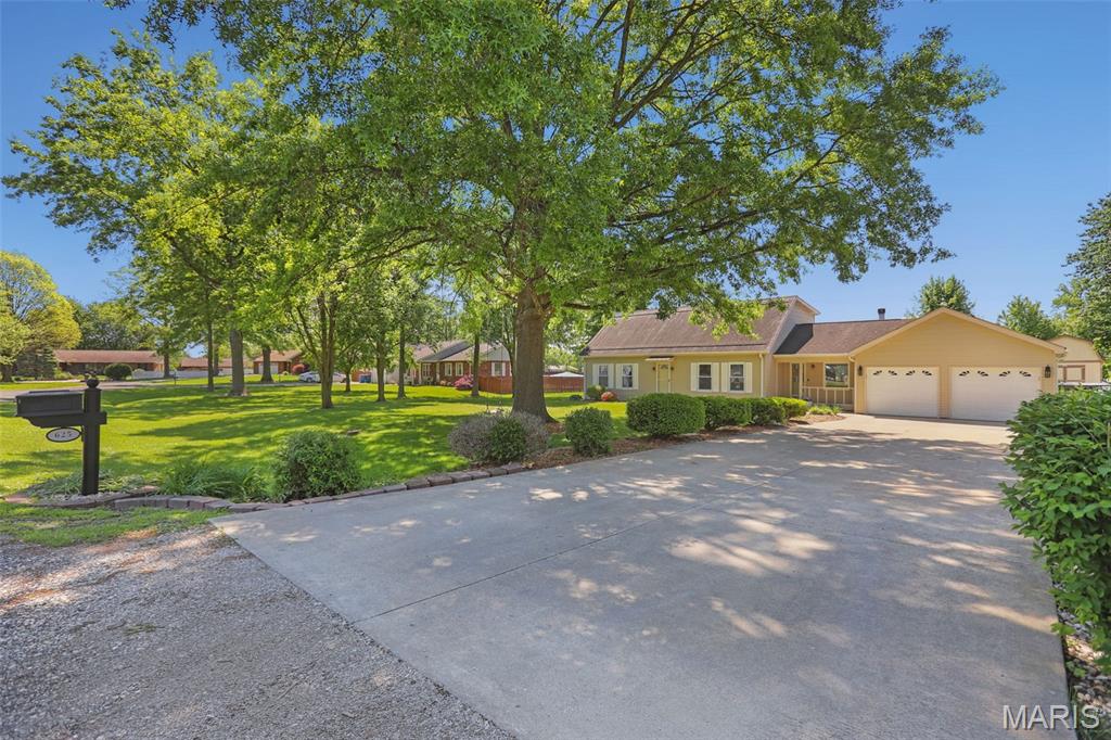 The home you’ve been waiting for! Experience the best of Troy in this established, tree-lined neighborhood. Situated on a quiet cul-de-sac on nearly an acre, this 5-bedroom, 2-bath masterpiece offers the perfect balance of privacy and convenience. Enjoy a backyard oasis complete with a screened-in patio, pool, and fully-fenced yard. Inside, the stunning kitchen features brand-new custom cabinetry, quartz countertops, stainless steel appliances, and a premium pantry with a built-in appliance garage. The main level also offers spacious living and dining areas, a den with fireplace, three bedrooms, and a full bath. The upper level features two more bedrooms, an additional full bathroom, and a dedicated laundry room. Bedrooms throughout the home are finished with closet built-ins for effortless organization and the entire home has been freshly painted with many recent updates. Located within walking distance to CA Henning Elementary School (part of the Triad School District) and with easy access to Scott AFB and St. Louis — this move-in-ready home might just be the one. Schedule your tour today!