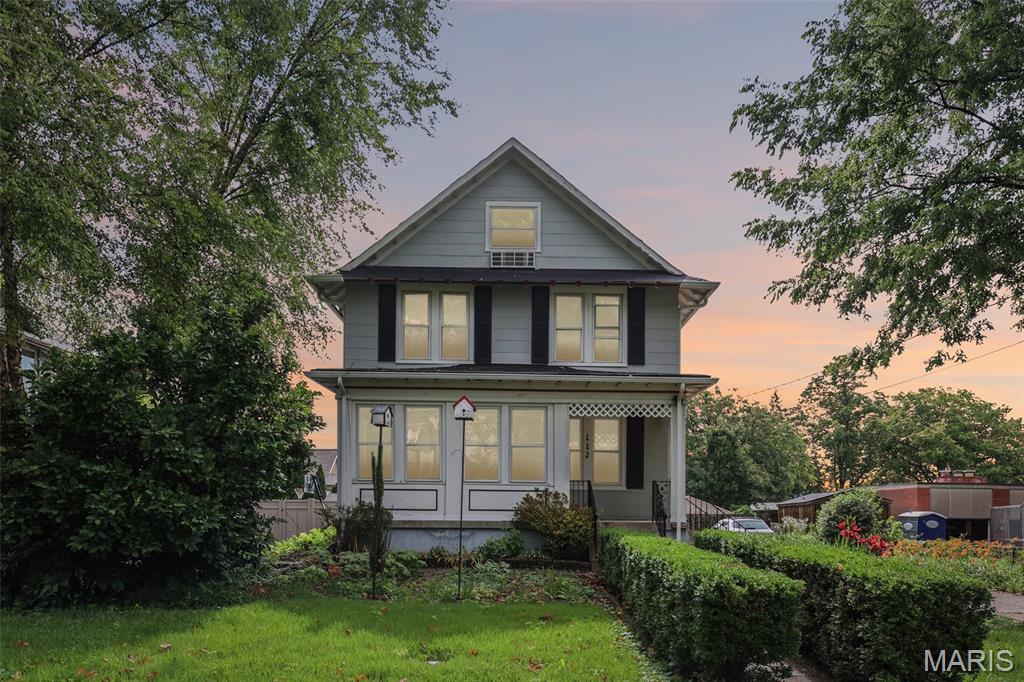 Discover this charming 4 bedroom, 2.5 bathroom single family home located at 112 N Harrison, offering the ultimate walkable downtown Kirkwood lifestyle just steps from local shops and restaurants. This home preserved its historic architectural character with original hardwood floors throughout the main and second levels, classic built-in living room bookshelves, and stunning stained-glass windows. The highly functional layout features main-floor laundry, four spacious bedrooms on the second floor, and a fully finished third-floor bonus living space complete with an additional full bathroom. Outdoor enthusiasts will love the landscaped backyard oasis, which serves as a true gardener's dream featuring a dedicated composting area, expansive flower and vegetable beds, and a large backyard deck positioned for optimal afternoon shade and scenic views.