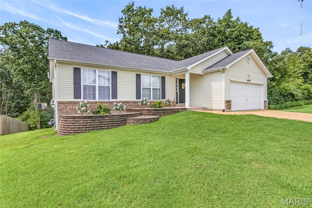 Welcome to this beautiful home that features a spacious open floor plan with plenty of natural lighting and a finished basement, providing additional living or entertaining space. The home sits in a desirable subdivision perfect for long walks and enjoying the neighborhood and is conveniently located near the highway. Enjoy the privacy of backing to woods, along with a large open lot next to the property that adds to the spacious feel. A great opportunity for anyone looking for comfort, convenience, and plenty of room to enjoy both inside and out.