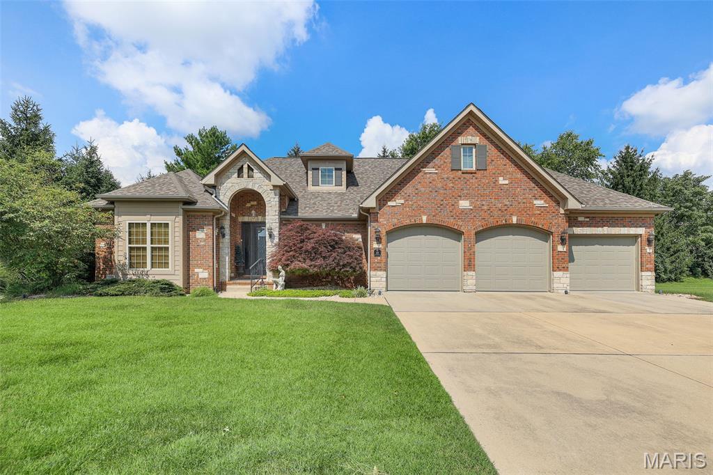Welcome to this beautiful ranch-style home, thoughtfully upgraded throughout with quality finishes and timeless elegance.  From the moment you step inside, you'll appreciate the attention to detail, including extensive woodwork, crown molding, stylish finishes, and an upscale atmosphere that makes this home special.  The spacious, inviting layout with an open living room, kitchen & breakfast room and formal dining area offers comfortable one-level living while providing plenty of room for entertaining and everyday life.  Numerous upgrades enhance both the beauty and functionality of the home, creating a move-in-ready property with a sophisticated yet welcoming feel.  Enjoy the living room with a fireplace and a view of one of  the private subdivision fountains.  The open kitchen with nice wood cabinetry, solid surface counters, an island plus a wonderful enclosed 4 season room, the first floor laundry room plus a fabulous master suite will please most buyers. The family room, 3rd bedroom and bath in the lower level add additional space and still has ample storage.  
With its exceptional craftsmanship, elegant details and beautifully maintained interior, this stunning ranch is the perfect blend of comfort, style & luxury.