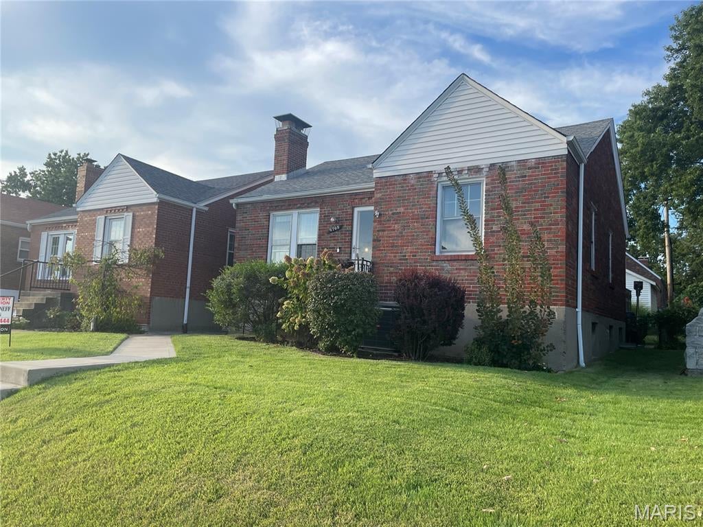 Charming brick bungalow conveniently located in the Lindenwood Park Neighborhood. The main level features a large inviting living room with a cozy woodburning fireplace which opens to an updated kitchen complete with a solid surface breakfast bar. Most areas have hardwood & ceramic tile floors, and there is an updated hall bath off the center hall. A primary bedroom with sitting room walks out to a well-manicured rear yard with patio and firepit - perfect for outdoor entertaining. The partially finished basement offers a family room, bonus area, and another full bath. Additional features include electrical & plumbing updates, and there is a sump pump with drain tile in the basement.