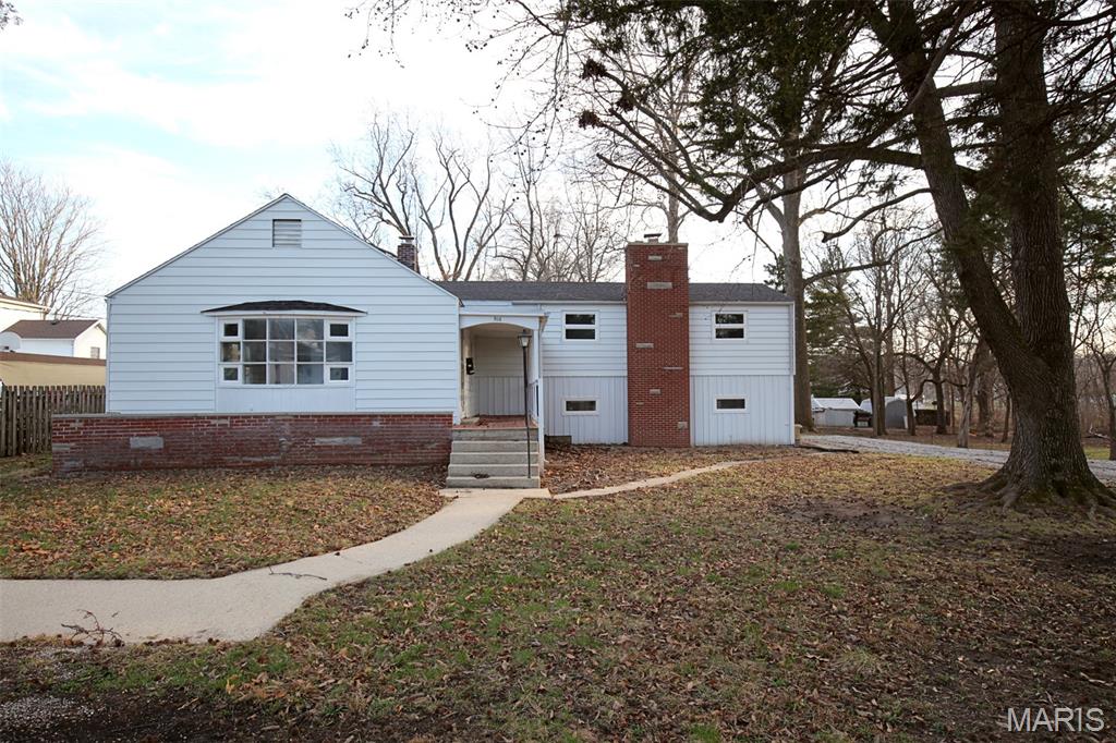 Location, location, location! Updated tri-level home offering 3 bedrooms and 2 bathrooms with numerous improvements throughout, situated on approximately 0.78 acre consisting of four lots. The home features luxury vinyl plank flooring throughout most of the house, with wood flooring in the two upstairs bedrooms. The updated kitchen includes new cabinetry, butcher block countertops, sink, and space available for a dishwasher. Both bathrooms have been updated, including a fully remodeled main-level bathroom that now features convenient main-level laundry. Additional updates include new vanities, toilets, and a recently installed roof (2025). The unfinished basement provides ample storage space. The HVAC system has been recently professionally serviced, and the brick chimneys have been tuck-pointed. Located in a great neighborhood and close to parks and schools, this property offers plenty of outdoor space and endless possibilities.