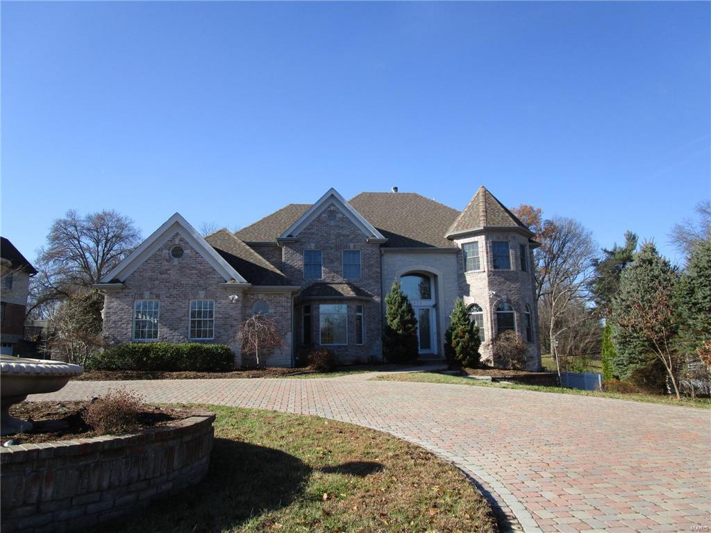 Stunning newer house with approx 7162 square feet of Living Space in Ladue Schools.  So much to love here.  The circular driveway leads to a 2 Story entrance with marble tile.  The large kitchen with center island has so much to love for the chef in the family.  The main floor master features jacuzzi tub and separate shower with his & hers sinks.  The basement is finished and has a mother in law's quarter that walks out to the back yard.  2 Fireplaces on the main level and 1 in the basement for those cold winter nights.  Large deep lot with gazebo has plenty of room for outdoor activies.  You will love the wood paneled office in the front of the house just off the entrance. SpecialListingConditions: Foreclosure