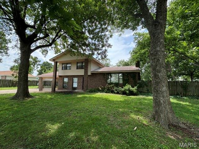 Located just outside the city limits in a  rural subdivision, this spacious home offers over 2,200 square feet of living space with the convenience of natural gas, county water, and county sewer services.

Step through the front door into a welcoming foyer highlighted by unique rustic terracotta tile flooring that adds warmth and character. The main living area features an open-concept design with a comfortable living room showcasing a fireplace, a dining area, and a functional kitchen perfect for everyday living and entertaining.

The upper level includes three bedrooms, including a primary suite with a private full bath, plus an additional full hall bath serving the remaining bedrooms.

Just off the kitchen, a few steps down leads to a hallway with a half bath and a versatile bonus room currently used as a bedroom. With patio doors opening to the backyard, this space could easily serve as a home office, hobby room, playroom, or guest room.

Another step-down area from the kitchen leads to a glass-enclosed patio/sunroom complete with a ¾ bath, split-unit heating and cooling system, and ventless wall heater. This flexible space offers endless possibilities as an office, recreation room, guest suite, or entertaining area, with direct access to the backyard through patio doors.

The privacy-fenced backyard is designed for enjoyment, featuring a patio, above-ground pool, fruit trees, and plenty of room for outdoor activities. A bonus storage shed with an overhead door is attached to the rear of the garage, providing excellent space for tools, equipment, or hobbies.

The property is further enhanced by mature shade trees in the front yard, creating curb appeal and a welcoming setting to call home.

** Interior photos coming soon..........   Shown by Appointment ONLY.