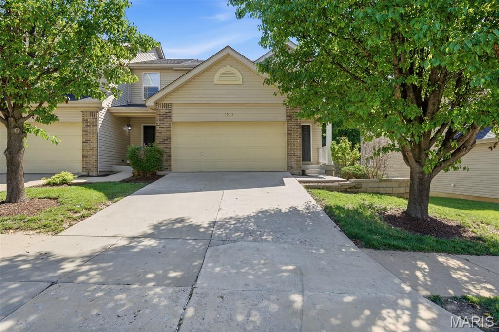 Tired of shoveling snow, spending weekends maintaining the yard, or worrying about the next big storm and what it might do to your roof? Leave those concerns behind and enjoy low-maintenance living at The Terrace at Columbus Pointe!

Located just minutes from charming downtown Cottleville, where shopping, dining, and entertainment abound, this 2-bedroom, 2 bath end-unit townhome offers the perfect blend of convenience and comfort. A spacious entryway welcomes you inside and leads to an open-concept main level where the living room flows seamlessly into the kitchen/dining area. The kitchen features rich espresso cabinetry, a large pantry, and a black appliance suite, making meal prep and entertaining a breeze.

Upstairs, you'll find two generously sized bedrooms, two full bathrooms, and a versatile loft nook that would make the perfect reading corner, hobby space or play area. The spacious primary suite includes a private full bath and not one, but TWO walk-in closets. Across the hall, the second bedroom also features its own walk-in closet and convenient access to the second full bath with a linen closet inside.

The finished lower level adds even more flexible living space and includes laundry, two storage closets, and a bonus room ideal for a home office, workout area, playroom, or second family room. A private deck overlooking the backyard and an attached two-car garage complete the home.

Whether you're looking to simplify your lifestyle, spend less time on maintenance, or enjoy all that Cottleville has to offer, this townhome is ready to welcome you home.