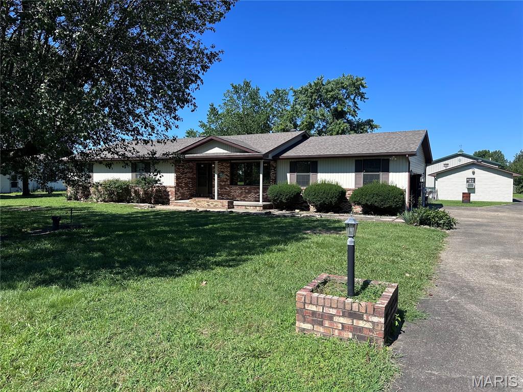 Looking for a spacious home just outside of Sikeston in Kelly school district? The property includes 30x50 metal shop with two oversized garage doors, electric, heat, A/C, bathroom and a nice covered side porch. An additional workshop in the back yard with electric.  This home has ample storage, a nice front porch and sun room on the back. This property is in good condition and ready for new owners! * Better and many more photos to be added in the next few days*