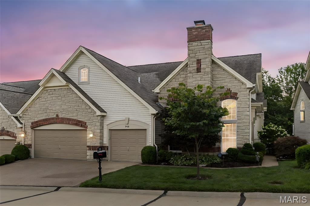 Welcome to one of the largest Villa floor plans in The Knolls. The Main Level is a combination of stone and wood floorings and is accentuated by crown and decorative mouldings.  Through the entry you find the 17 x 15 Living Room perfect for office, conversation or music room. Culinary enthusiasts will delight in the chef’s kitchen, featuring 42" custom cabinetry; granite; 6-burner Viking stove/oven; Thermador oven/warming drawer; split double-drawer Dishwasher; separate beverage cooler drawers; ice maker; pantry; and built-in side by side freezer/refrigerator.  Guests can gather around the large center island and enjoy all the fun while the hosts conduct their magic!

From the kitchen, you will not find a better gathering spot than the Great Room with its impressive stone hearth and gas fireplace. The 21' ceilings are accented with gorgeous Andersen windows which look out to the composite deck.  The 26 x 15 Main Floor Primary Suite is a retreat w/ hardwood floors, 2 walk-in closets and privacy.  The opulent bathroom has separate vanities, a jetted tub, large shower and private entry to the main floor laundry.

The UL w/ Juliette balcony has 2 Ensuite Bedrooms w/ plush carpet and neutral decor. The Lower Level walk-out has family room, Ensuite Bedroom and full kitchen--ready to pamper your overnight guests.  The 3 car garage has epoxy floors, cabinetry + mud room entry. Other features: Washer/Dryer/Central Vac/Invisible Fence and GATED COMMUNITY.  A true gem in 63005!