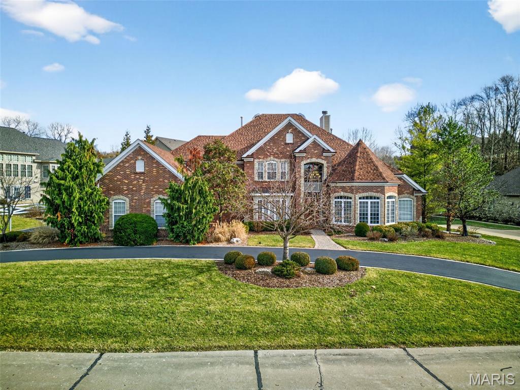 You’ve found your dream home—don’t miss out!
From the moment you pull into the driveway, you’ll think wow. As you and your guests step inside, an incredible sense of warmth and elegance welcomes you. Soaring atrium windows flood the home with natural light, while stunning coffered ceilings and custom-designed flooring showcase exceptional craftsmanship throughout.

After a long day, retreat to the luxurious main-floor primary suite. The spa-inspired bathroom features heated floors to keep your feet warm, a waterfall-style shower, and a private sauna—perfect for relaxation and stress relief. The cozy sleeping area includes two walk-in closets and a beautiful double-sided ventless fireplace, creating a serene and inviting atmosphere.

Feeling refreshed, make your way to the expansive kitchen—designed for both everyday living and entertaining. With ample space to host gatherings, the kitchen boasts granite countertops, stainless steel appliances, double sinks, and exceptional lighting. Rich wood floors flow seamlessly into the hearth room and sitting area, where you can enjoy the glow of a fireplace while preparing dinner and entertaining guests.

To complete the experience, the home is wired with speakers and a sound system throughout much of the house, allowing you to enjoy your favorite music whether you’re hosting a party or unwinding for the evening.

This home truly offers everything you want—and everything you deserve.

Whether you’re unwinding or entertaining, enjoy the stylish main-floor bar area, or head downstairs to a second bar paired with a beautiful game room—perfect for playing pool or hosting game nights in the additional entertainment space. The lower level also offers a bedroom and full bathroom, providing comfort and privacy for overnight guests.

When the evening comes to an end, retreat to the main-floor primary suite, while family and guests can settle into one of three spacious bedrooms on the second floor. This level also features three additional bathrooms, ensuring everyone has their own space. If the night isn’t quite over, the open loft area upstairs offers a comfortable spot to relax before turning in.

The home is thoughtfully designed with laundry rooms on both the main and second floors for added convenience. Additional highlights include three HVAC systems, two water heaters, a beautiful exterior patio ideal for enjoying warm evenings, and an impressive four-car garage featuring a durable epoxy flake floor.