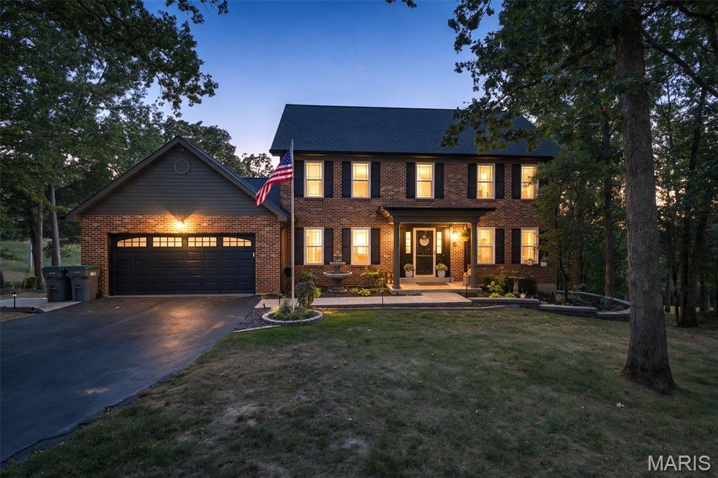 Welcome to Ridgeview Acres, where timeless design meets modern updates on a stunning wooded 2-acre setting. This move-in ready, 2-story home offers 4 bedrooms, 2 full baths, 2 half baths, and a 2-car garage, all wrapped in beautiful curb appeal. The traditional floor plan provides the perfect blend of elegance and functionality, featuring a formal dining room accented by a chandelier and a formal living room that easily serves as a home office, playroom, or flex space.
The heart of the home is the spacious kitchen, featuring granite countertops, a chic backsplash, center island, and pantry. The main-floor laundry room is conveniently located and provides plenty of storage. Gather in the inviting great room featuring a striking brick, wood-burning fireplace and wet bar, creating the perfect space for entertaining or relaxing. Upstairs, you'll find comfortable bedroom accommodations, while the finished walkout basement expands your living and entertaining options.
Step outside and enjoy your private backyard retreat. The screened porch overlooks the inground pool and beautiful wooded acreage, offering peaceful views year-round. The covered patio at the walkout level provides additional outdoor living space ideal for poolside entertaining, special gatherings, or quiet evenings at home. An irrigation system helps keep the grounds looking their best.
Major improvements have already been completed, including the roof, septic system, windows, lighting, and more, giving buyers peace of mind. Combining classic architecture, thoughtful updates, exceptional outdoor amenities, and a highly desirable Ridgeview Acres location, this is a home that truly never goes out of style.  Move-in ready, beautifully maintained, and designed for everyday living and entertaining!
BE PREPARED TO FALL IN LOVE!  (Some of the photographs of this home have been virtually staged using AI)