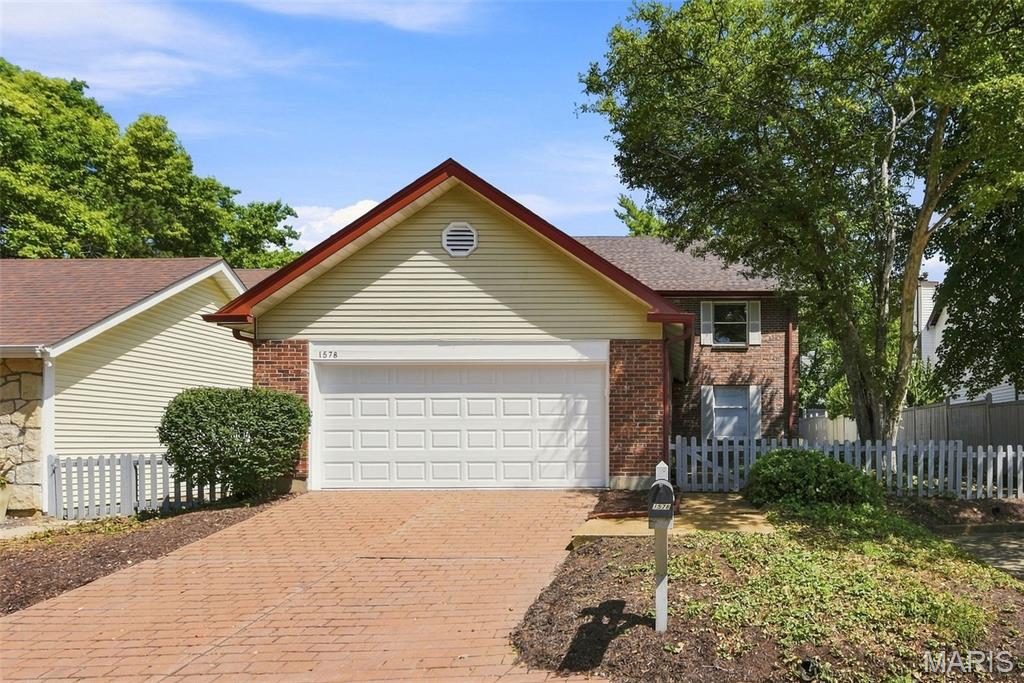 Fabulous 2-story villa in a sought-after Chesterfield location! Step through the charming gated fence into a beautifully landscaped courtyard and spacious covered porch. Inside, stylish wood floors flow throughout most of the main level. Elegant living and dining rooms flank the welcoming foyer.

The spacious chef’s kitchen features abundant cabinetry, stylish countertops, stainless steel appliances and tile flooring. A convenient main-floor laundry room offers additional cabinetry and an exterior door leading to the patio. The inviting family room features a fireplace and atrium doors (2024) opening to the spacious patio, while a stylishly updated powder room (2024) completes the main level.

Upstairs, retreat to the luxurious primary suite featuring a generous sleeping area, adjoining sitting room with built-in bookshelves, beautifully remodeled bath (2024) and spacious walk-in closet. Two additional generously sized bedrooms, an updated hall bath (2024) and linen closet complete the second floor.

The lower level offers excellent potential for future finished living space while providing plenty of storage. Outdoors, enjoy the peaceful brick patio surrounded by a wood privacy fence—an inviting spot to relax or entertain.   Additional updates include architectural shingle roof (2024), AC (2020) furnace (2021), hot water heater (2021), garage door and opener (2026)