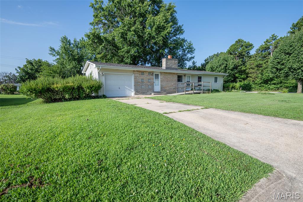 Discover an inviting single-family residence, ready for you to move in, located on a corner lot at 609 Elm AVE, BLAND MO 65014. This ranch-style home offers a harmonious blend of comfort and practicality, designed for a relaxed lifestyle. The heart of this home, the kitchen, provides both an island and a peninsula, offering versatile spaces for meal preparation and casual dining. The bathroom is thoughtfully appointed with a double vanity, ensuring convenience and ease. With three comfortable bedrooms, this residence provides ample private space. An attached garage offers direct access, while a basement provides additional functional possibilities. Outside, a patio and a porch extend the living areas, perfect for enjoying the outdoors. Embrace the opportunity to experience the thoughtful design and comfortable living offered by this delightful property.