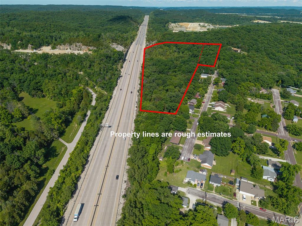 TWO properties combined for INVESTMENT potential!  The largest parcel (9.7 acres), located on N. Columbus, is outside Pacific city limits but has access to sewer so could easily be incorporated into the city for a great location for multi-family units or storage facilities.  The county also allows many other options per the "B" Zoning district for commercial type sales, billboard advertising, hotel/motel facilities, light manufacturing, kennels or other options...see attached list of permitted uses!   Great exposure along I-44 for easy advertising opportunities, too!  The smaller attached lot (1.3 acres) runs along High Street for access to city water and the rock based drive & walking path leads to a solid, level area surrounded by mature trees. Aerial map shows the outline of the property which is more level off of N. Columbus but there are some level areas off of High Street but could easily be excavated for many types of uses.  Wooded acreage that runs behind a residential area so this property has much to offer the investor looking for that new project at a reasonable price!  Check it out TODAY!!  **Stakes marked with orange ribbon for approximate location of some property corners.** 
2nd Tax ID:  19-1-120-1-099-001000