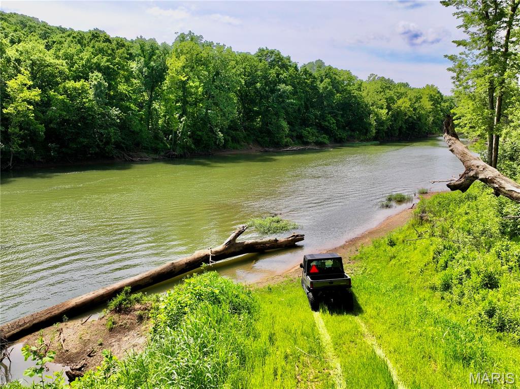 Discover the perfect blend of privacy, river access, and build potential on this exceptional 16.6-acre Gasconade River property. Featuring over 280 feet of private Gasconade River frontage and a secondary deeded access point just downstream to a beautiful gravel bar, this tract offers multiple ways to enjoy one of Missouri's most sought-after river systems.

A scenic gravel drive winds from the elevated build site down through the timber and into the river bottom, providing easy access to the water's edge. The property includes a boat-ramp-style river access, making it simple to launch a boat, kayak, or canoe and enjoy countless days on the water. From the elevated build location, you'll enjoy impressive views overlooking the river bottom while maintaining privacy among mature hardwood timber.

The land offers an excellent mix of open ground and mature timber, creating ideal opportunities for recreation, hunting, camping, or building your dream river retreat. Electric is available on the property, making future development even more convenient. Access is secured through an electric gate located just off a dead-end county road, leading into a private road system that enhances both privacy and security.

Conveniently located just 3.5 miles from the I-44 and Highway 133 junction, this property combines easy access with a secluded setting that's increasingly difficult to find. Whether you're looking for a weekend getaway, future homesite, or recreational investment, this Gasconade River tract delivers. Additional adjoining acreage is also available for purchase, offering the opportunity to expand your riverfront holdings.