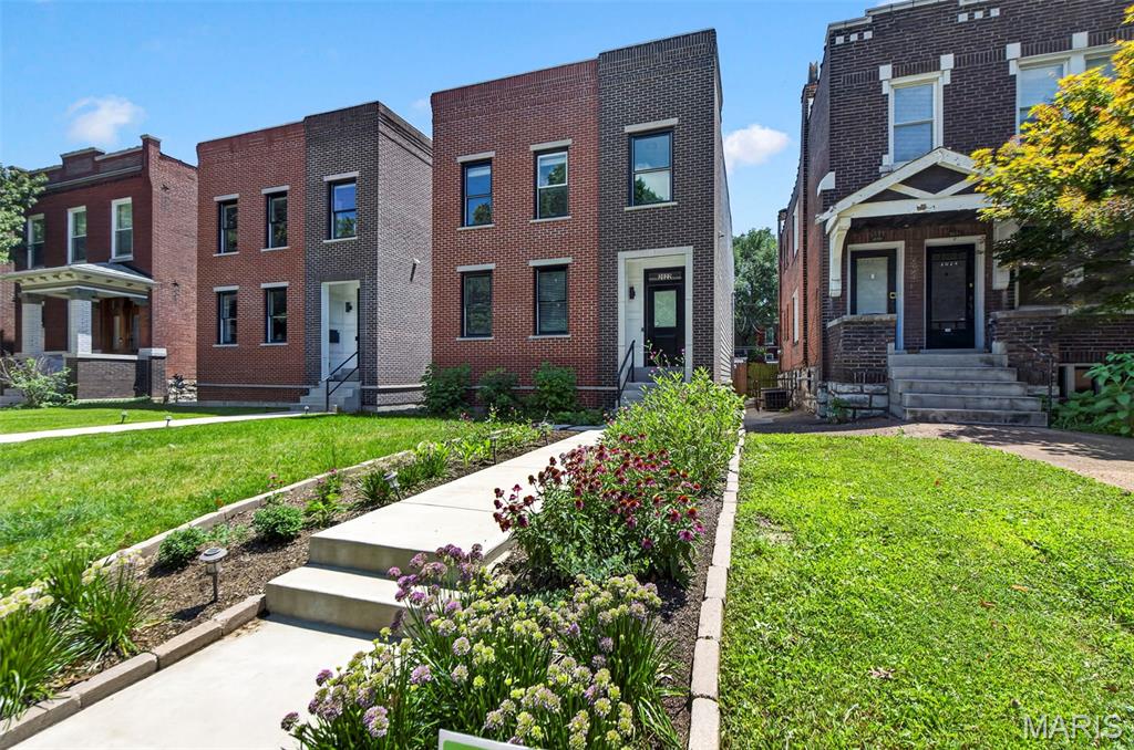 Experience the excitement of chic, contemporary living in this brand-new modern home just steps from vibrant Lafayette Square! Built with striking brick and Hardie board accents, this home is loaded with luxury upgrades—soaring 9-ft ceilings, gleaming wood floors, quartz countertops, a relaxing back deck, and even a private balcony. Step inside to an open, effortless floor plan designed for both spectacular entertaining and comfortable everyday living. The gorgeous chef’s kitchen features a European vented hood, stylish chevron tile backsplash, French door refrigerator, and a sleek built-in Sharp microwave—everything you need to cook in style! The tall 10 ft ceilings and wide plank hardwood floors are EVERYTHING! Wide wood staircases with modern metal railings guide you to the spacious upper level, where you’ll find a generous laundry room and a showstopping primary suite complete with a walk-in closet, rainfall shower with handheld sprayer, and a chic niche for all your essentials. Both the hall bath and primary bath offer elegant double-sink vanities. Two other bedrooms finish off the upstairs area. The partially finished lower level adds even more versatility, boasting a full en-suite bath and a 4th bedroom—perfect for guests, a home office, or creative space. Outside, enjoy a serene, wooded, fenced yard and a 2-car detached garage. This is all just within minutes from fantastic eateries, charming parks, and the energy of one of the city’s most beloved neighborhoods. This is modern living at its finest—welcome home!