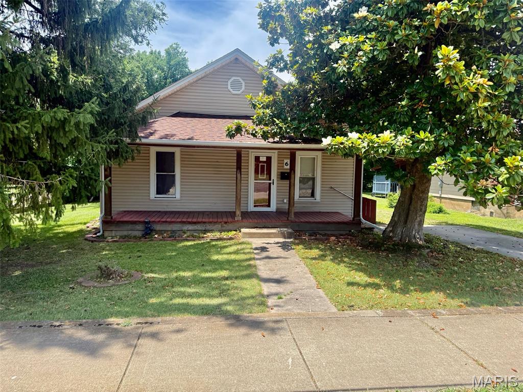 This home features an open living room & dining room combination with a lovely wood-burning fireplace. Good-sized kitchen with a bonus room attached for breakfast room, office, or a sun room! The largest bedroom has built-in cabinets and a walk-in closet large enough to add another bathroom. Laundry room off the kitchen. Large fenced back yard that's perfect for entertaining. Cozy covered front porch. There is a full basement and plenty of off-street parking. Call for your tour to see if this will be your next move.