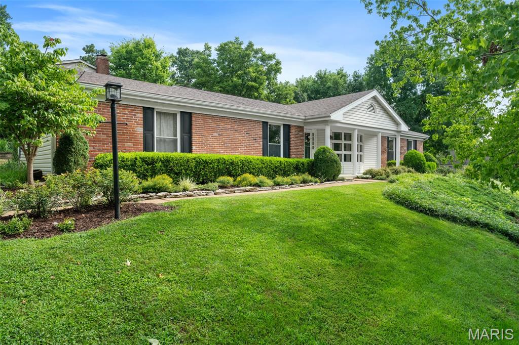 A rare opportunity to own a beautiful ranch home in Des Peres' Dougherty Lake Subdivision! Walking up to the home, you'll find that the covered front porch and manicured landscaping make for excellent curb appeal. Enter into a spacious foyer with a coat closet and sight-lines through the living room into the family room in this lovely, partially open floor plan. The living room features a gorgeous bow window which brings in an abundance of natural light. The family room features a fireplace with built-in bookcases and opens to the gorgeously renovated kitchen. The kitchen is a beautiful, neutral palette with a generous amount of custom cabinetry and counter space. Down the hall from the family room are 3 bedrooms, including a primary en suite, and a delightful hall bath. The primary en suite features a large walk-in closet and full bathroom with a step-in shower. The second and third bedrooms are perfect for young ones, guests, or a home office. A convenient laundry room was created from a fourth main floor bedroom. Downstairs, you'll find the reason why most love a ranch home - it goes on and on! As you enter the basement there is a billiards room, wet bar, and half bath, along with a massive storage room on either side of the staircase and includes a walk-in cedar closet. The walk-out basement has an open family room for a TV area and sliding glass door out to the patio. A fourth bedroom with egress window provides an additional sleeping area or flex space. The screened-in porch has a pebble-coated covering and offers access to the engineered deck and backyard. An oversized two car garage and turn around driveway make this home complete. Truly a wonderfully low maintenance, one-level living option! Dougherty Lake is a phenomenal community, anchored by a prominent lake, playground, and basketball court, as well as a forest with walking trails. It's the kind of neighborhood where residents still get together for block parties, fishing at the lake, 4th of July Parades, haunted houses, and much more!