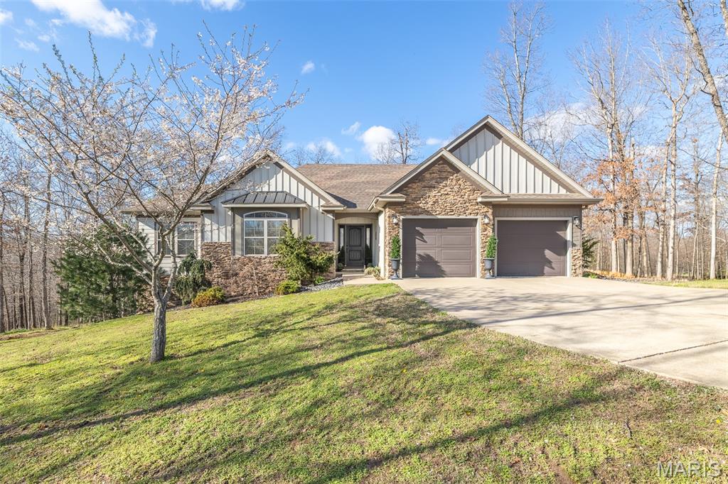 Welcome to this stunning, spacious home offering 3,740 +/- sq ft of living space, perfectly situated on 2.88 +/- acres in Poplar Bluff! This beautifully designed 6-bedroom, 3 full bath home combines comfort, style, and functionality for modern living.

The custom kitchen is a true centerpiece, featuring High-End finishes and direct access to a walkout deck—ideal for entertaining or enjoying peaceful views of the property. The main-level master suite offers a relaxing retreat with a large walk-in closet, while the master bath boasts a custom tile shower and a luxurious freestanding soaking tub.

Downstairs, the fully finished basement provides additional living and entertaining space with stained concrete floors, a wet bar, and built-in wine/drink fridge along with an ice maker—perfect for hosting guests or creating your own private getaway.

Step outside to enjoy the custom-built outdoor gas fire pit, making this property just as inviting outdoors as it is inside. The house is also equipped with permanent Christmas rgb led lights. That outline the front of the house so you can celebrate any holiday. With ample space, high-end features, and a serene setting, this home is a must-see!
