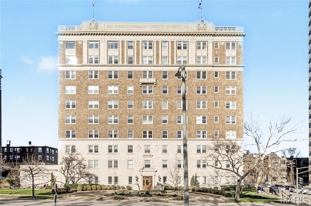 Rare opportunity to own a beautifully appointed condo in the historic Versailles situated across from Forest Park. The charm of the building is showcased by the stunning lobbies. The entry welcomes you with a front desk attendant who ensures security and convenience for residents. This renovated three bedroom, two bath condo on the third floor has an amazing inviting floor plan with unique design elements to include custom renovated Butler's pantry and Kitchen and hard wood floors. Enter the foyer which brings you to the open living spaces. A large sunlit living room on one side & an open spacious dining room accessing the kitchen on the other. The living room amenities include a decorative fireplace. Off the main living space, you are met with a long gallery hallway that houses the two main bedrooms and primary bath with closets galore. Both baths have been beautifully renovated. The third bedroom off the kitchen, has in-unit laundry hook-ups. One garage space & storage accompanies the property. The condo fee includes 24 hour doorman, building maintenance, some insurance, heating, a/c, electric, water, sewer, trash (so, no utility bills except internet!).