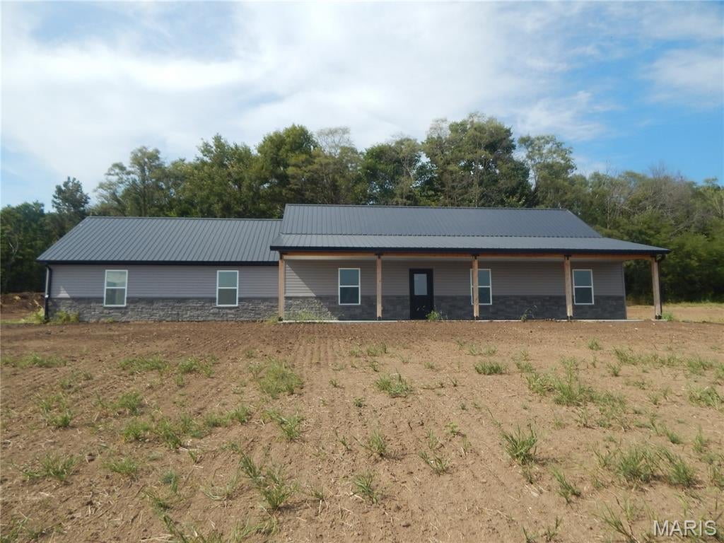 Beautiful Newly constructed home on 3.13 ac with Tree line in Mark Twain School District located minutes from New London & Hwy 61. The home boasts an open floor plan with spacious kitchen featuring custom Amish made Cabinets, granite counter tops & stainless-steel appliances. Has a 1-year builder warranty.