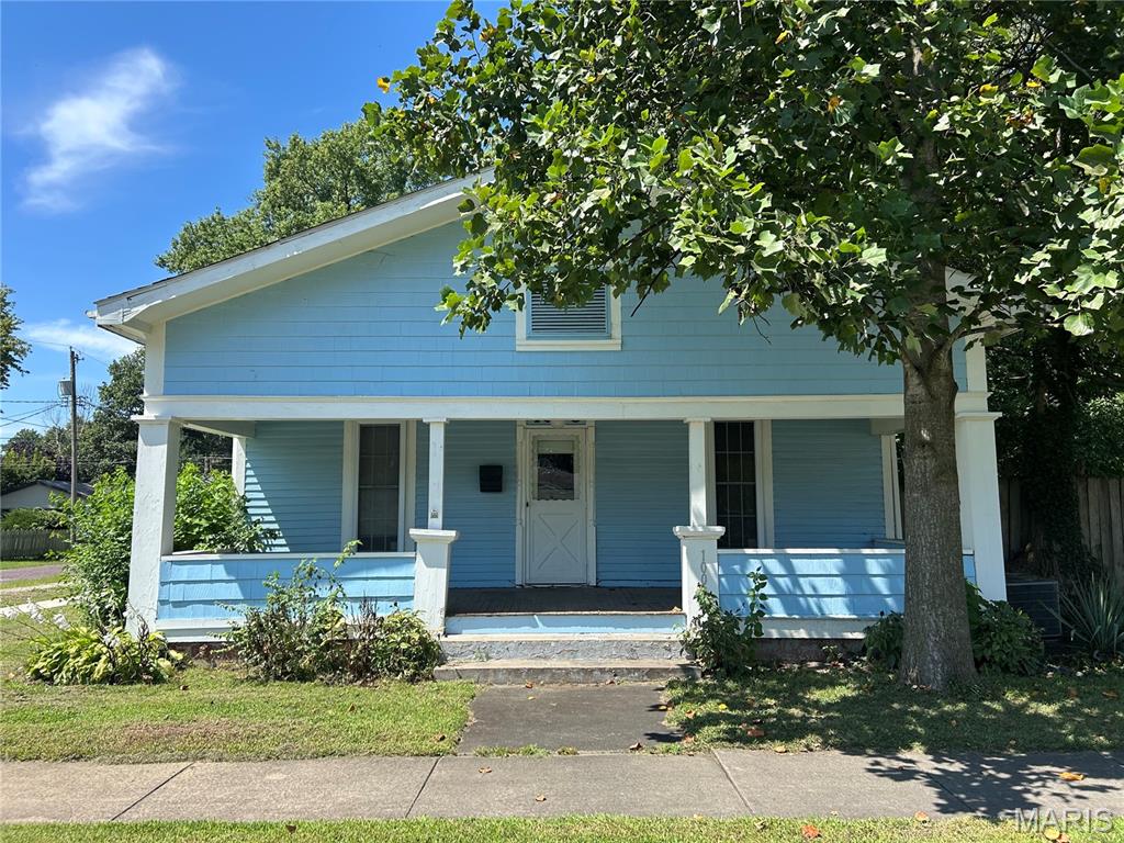 CHARACTER AND CRAFTSMANSHIP! Welcome to this 2 bedroom, 1 bathroom home that is full of details you just don’t find in newer construction! From the moment you step inside, you’ll notice the beautiful original woodwork, coffered ceilings, built-ins, and charming architectural details throughout. The home offers spacious living and dining areas with plenty of natural light, plus a large eat-in kitchen with abundant cabinet and counter space. Generously sized rooms throughout. Outside, you’ll find a covered front porch, a back deck surrounded by mature trees, and a large detached garage with tons of room for vehicles, a workshop, hobbies, or extra storage. Home is on a double lot and also has a park like yard. This home does need updating and some TLC, but the character is already here—and there’s plenty of potential for someone ready to bring it back to life. Whether you’re looking for a home to make your own or your next renovation project, this one is worth a look! Seller will not rent or do Contract for Deed. Cash only, as is.