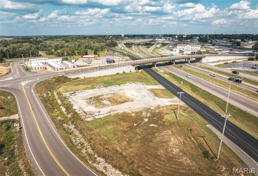 Interstate I-44 Exposure. 0.69 acres m/l of prime commerical property located just off of Sullivan Exit 225 near the Elmont overpass. This property has the benefit of the residential boom in Sullivan these past few years with continued residential building happening at a rapid pace.  The Elmont overpass was developed for the continued growth of Sullivan and the outlying areas to the north. This high traffic corner has an average daily traffic count of 31,000 from I-44 with 277' of road frontage. City utilities available. The traffic count is projected to reach a staggering 80,000+ by 2035. Take advantage of the boom in residential building, easy access, and I-44 access & exposure. Perfect location for a coffee shop, convenience store, gasoline station, retail operation, restaurant or automotive...just to name a few. Ideally located for maximum visibility and high traffic. Location: City, High Traffic, Hwy/Interstate Frntg