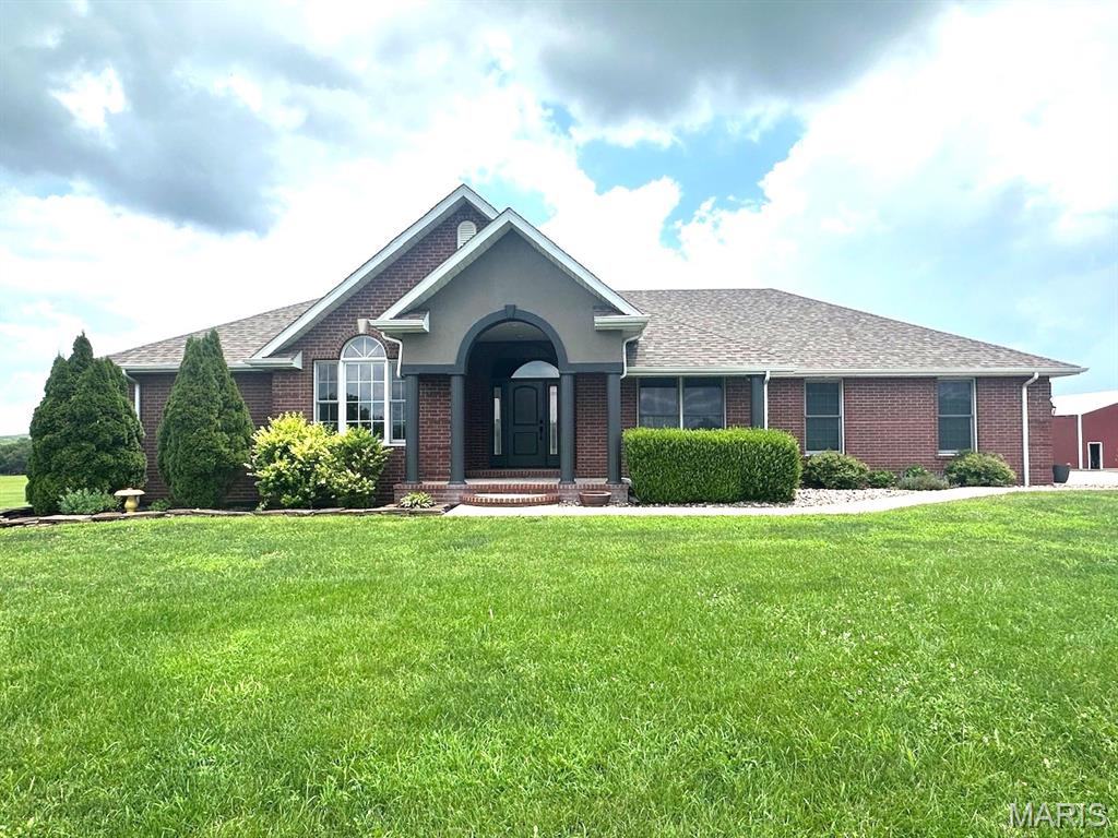 THIS MAJESTIC HOME OVERLOOKS NEARLY 17 ACRES OF LUSH PASTURE. AN ASPHALT DRIVE CIRCLES UP TO THE HOUSE, WITH A WHITE VINYL FENCE ALL ALONG THE WAY, TO ARTISTICALLY STAMPED CONCRETE IN FRONT OF THE GARAGE DOORS. THERE IS ALSO A POND ON THE PROPERTY. THREE BEDROOMS ON THE MAIN FLOOR. LIVING ROOM HAS A GAS FIREPLACE AND THE DINING ROOM IS SEPARATE. THE KITCHEN HAS MANY CUSTOM CABINETS, STAINLESS STEEL APPLIANCES, INCLUDING A WALL OVEN, AND ELECTRIC COOKTOP. THE KITCHEN LOOKS INTO THE LIVING ROOM OR OVER TO THE BREAKFAST AREA. CERAMIC TILE, PLUSH CARPET, AND VINYL LAMINATE COVER ALL THE FLOORS BEAUTIFULLY. THE MASTER SUITE INCLUDES A GREAT MASTER BATH WITH SEPARATE WHIRLPOOL TUB AND SHOWER, AND LARGE WALK IN CLOSET. OUT THROUGH GORGEOUS LIVING ROOM WINDOWS YOU WILL FIND A GREAT PLACE TO RELAX, A NICE PATIO, BESIDE A GREAT IN GROUND POOL. THE HOME HAS A WONDERUL FULLY FINISHED BASEMENT WHICH INCLUDES A GREAT FAMILY ROOM WITH FIREPLACE, A GREAT KITCHEN, AND A REALLY NICE BEDROOM AND BATH. PLUS LOTS OF STORAGE. FOR THE GUYS, A LARGE 40X80 SHOP , WILL HOUSE ALL OF YOUR MECHANICAL TOYS, TRACTORS, OR CARS AND TRUCKS. THE SHOP ALSO HAS A 20 FOOT LEAN TO ON THE SOUTH SIDE.  CAN ALSO BE BOUGHT WITH 16.95 ACRES FOR 799,900.00    THIS PLACE IS ONE OF A KIND, DON'T MISS THIS OPPORTUNITY BEFORE ITS GONE. CALL TODAY!