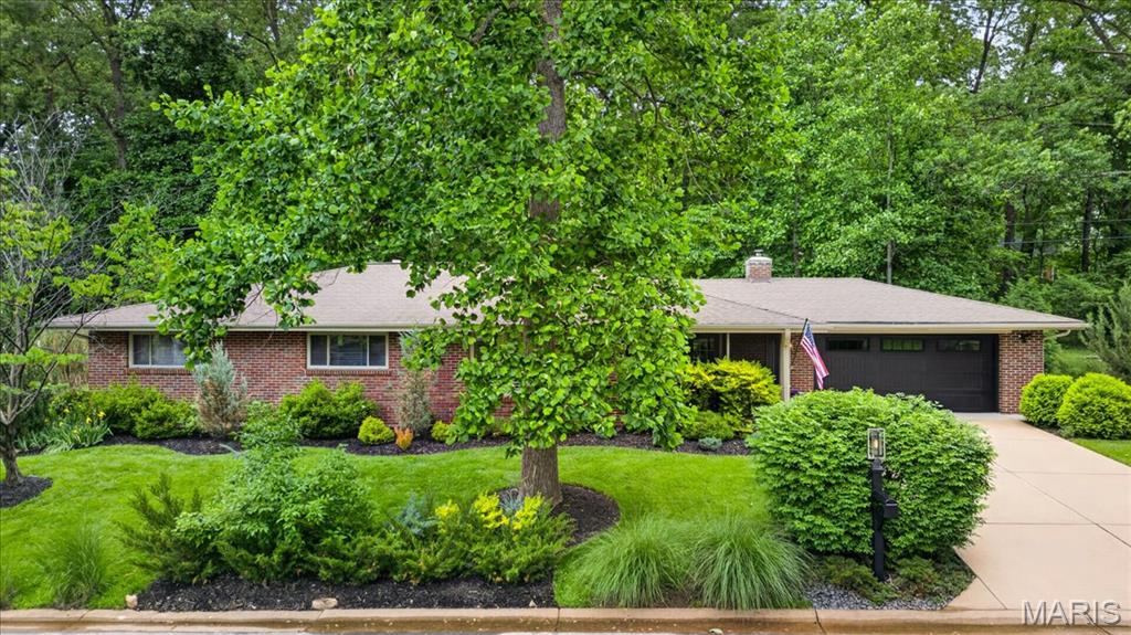Easy, elegant one-story living in one of St. Louis’ most beloved neighborhoods — Crystal Lake Park. Tasteful updates throughout complement the home's open and airy floor plan, creating seamless flow between the living room, dining area, and kitchen. Unwind on the private landscaped patio backing to peaceful, private woods, or settle into the sweet screened-in front porch for a quiet afternoon. A rare find in a premier location with Ladue Schools.