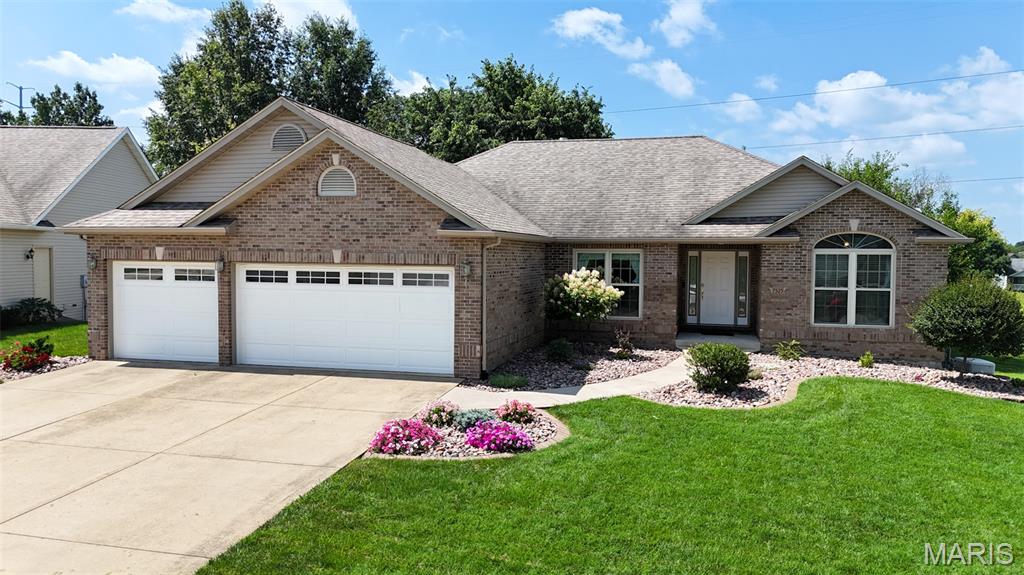 Back on the Market, No Fault to Sellers... Welcome to 7525 Stonebridge Golf Drive, a comfortably designed Atrium Ranch offering approx 3,100 square feet of living space and incredible potential in highly sought-after Manors at Stonebridge in Maryville, Illinois! Boasting 4 spacious bedrooms, 3 full bathrooms and an expansive open floor plan, this home has fantastic bones and is there is ample opportunity for you to add your personal touch. Add an egress window if you need a 5th bedroom, as the lower-level bonus room is bedroom-ready with its own closet and tray ceiling!
Step inside to discover soaring cathedral ceilings and a flood of natural light courtesy of the stunning atrium design. The inviting open-concept kitchen and breakfast room feature a highly functional layout with a large pantry, breakfast bar and double sink, offering a great footprint for functionality. Retreat to the main-floor primary suite, which features a generous walk-in closet and an en-suite bathroom that features separate vanities, jetted tub and a separate shower. Two additional bedrooms, a full guest bath and a convenient main-floor laundry room, with utility sink, complete the main level.
The finished walk-out lower level doubles your living space. It features a massive family room anchored by a cozy gas brick fireplace, a third full bathroom, a spacious bedroom and an additional room with closet—perfect for a guest suite, home office or hobby space. The unfinished side has a massive storage room with built-in shelving.
Step outside to enjoy peaceful outdoor living from your upper deck or the concrete patio below, all overlooking a nice sized, quarter-acre lot with expansive views to green space.  Other thoughtful features are the Whole House Reverse Osmosis Water Filtration System for peace of mind.This home also features a whole house generatior. This is the home for you!  Schedule your showing to decide where to put your furnishings before someone else does!