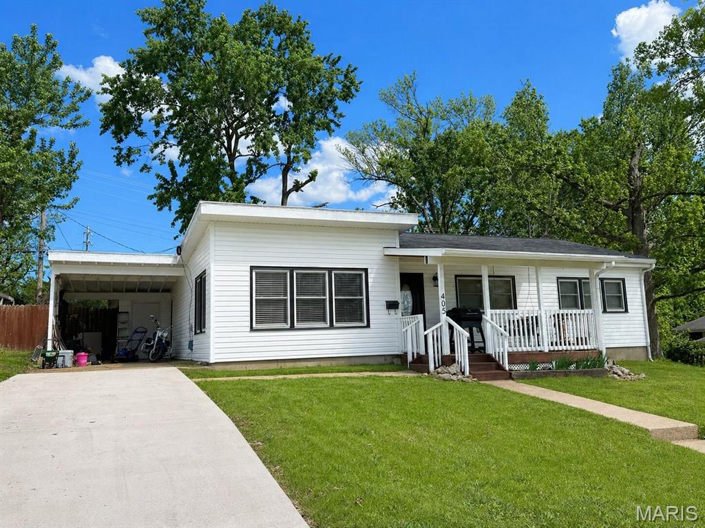 Welcome home to this adorable 3 bedroom, single-level residence. From the moment you arrive, you’ll be drawn in by the inviting curb appeal and welcoming covered front porch—an ideal spot to enjoy your morning coffee or unwind in the evening. Step inside to discover a bright and airy open floor plan that features partial vaulted ceilings with beautiful accent beams, creating a warm yet spacious atmosphere. Natural light flows seamlessly throughout with an open living/dining concept. The layout offers the perfect balance of openness and functionality. Step outside to the covered back porch—your private retreat for outdoor gatherings, grilling, or simply relaxing. The fenced backyard offers privacy and plenty of space for pets, play, or gardening. Recent updates bring peace of mind and include luxury vinyl flooring, new roof and vinyl siding all in 2025, adding both value and efficiency to the home. This charming home is the perfect blend of comfort, style, and convenience—ideal for first-time buyers, downsizers, or anyone looking for easy one-level living. Schedule your showing today!