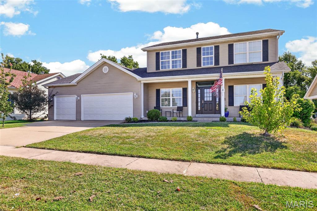 Spacious rooms, abundant natural light, and a functional floor plan make this former display home a standout in the highly sought-after Villages at Bainbridge. Offering over 2,300 square feet, this 2-story home features 4 bedrooms, 4 bathrooms, and plenty of space for everyday living and entertaining.

The main level welcomes you with 9-foot ceilings, crown molding, cased openings, and a wall of windows overlooking the tree-lined backyard. The family room features a gas fireplace and flows into the oversized breakfast/hearth room and kitchen, complete with a center island and beveled granite countertops.

Upstairs, the vaulted primary suite offers a double vanity, separate shower, and whirlpool tub. Three additional bedrooms and a full bath provide plenty of room for family or guests.

The finished lower level adds valuable living space with a sleeping area, half bath, and a large unfinished storage area. Additional features include main-floor laundry, a mud room, oversized 3-car garage, intercom system, newer HVAC, and a covered patio overlooking the backyard.

Enjoy all that Villages at Bainbridge has to offer, including a community pool, walking trails, and three stocked lakes for fishing. Conveniently located near shopping, dining, parks, and major highways, this home offers an excellent opportunity to make it your own in one of O’Fallon’s most desirable neighborhoods.