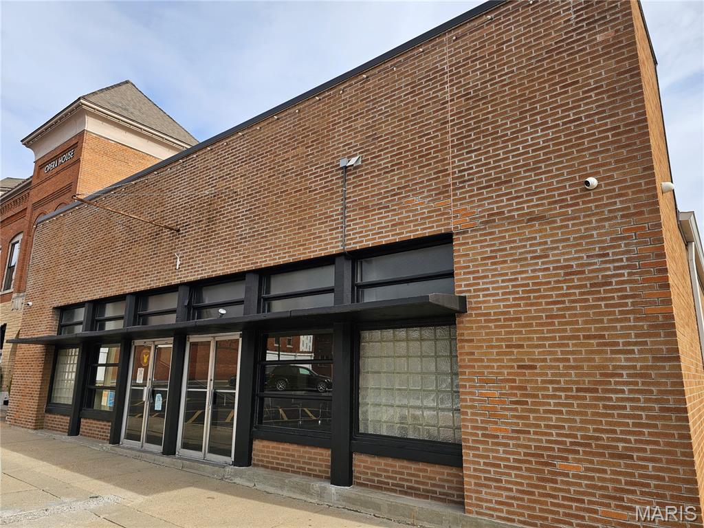 Amazing opportunity to own a historic piece of property in thriving, downtown Hillsboro! This building was constructed in approx. 1954 and has over 12,000 square feet of space in it! It has served the community as a lodge, meeting space, a spot for fundraisers, weddings, banquets, parties, pagents, music, shows and so much over the years! It has been used as a bar and restaurant the last few years with an event area on the Main St level. There are 2 kitchens in it, 4 handicap bathrooms, lots of storage, office space, meeting areas, a stage and a bar. Front, back and side entrances. The listing includes the large additional lot behind the building for parking and could easily be expanded even more.  Dreaming of owning your own business!  This is a great spot to start it!
