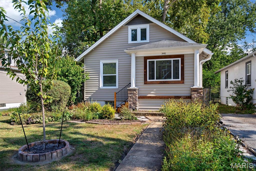 Historic charm meets modern updates at this wonderful Maplewood home. Character throughout: hardwood floors, original millwork, awesome built in pantry cabinet. Modern updates: low-e windows, hvac with humidifier, ductless Mitsubishi H&C unit on 2nd floor, updated electric and plumbing. The sunlit entry foyer is great for extra storage and plants. Leading into the lovely living room. Wonderful kitchen, featuring custom 42" custom cabinets, stainless steel appliances (all to stay), granite counters, stack stone backsplash and built in wine rack. Kitchen opens to spacious dining room, great for entertaining. The main floor bedroom with custom closet, updated full bath & laundry with stackable W&D (to stay) complete main floor. Head upstairs to find another bedroom and full bath. The walkout basement is nice bonus flex space as play/workout area or office space. The large fenced outdoor space is beautiful also with native plants and compost station. Nice storage shed for lawn mower and tools.