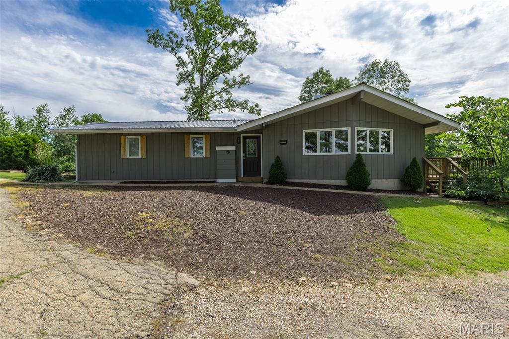 Just minutes from Ironton, this one-of-a-kind property offers the perfect blend of charm, comfort, and income potential. Featuring 2 bedrooms and 2 bathrooms, this adorable home is currently operating as a successful Airbnb and is packed with unique character throughout.The heart of the home is the stunning kitchen, where a double-sided wood-burning fireplace creates a warm and inviting focal point between the kitchen and living room. Large windows fill the space with natural light and frame breathtaking views of the surrounding scenery, making every season a picture-perfect backdrop.
Outside, you'll find even more opportunities with a detached garage that includes additional living quarters. While the space is ready for remodeling, the possibilities are endless—create a second rental unit to potentially double your income, design the ultimate guest house, or provide comfortable accommodations for family and friends.Whether you're looking for a primary residence, vacation getaway, investment property, or all three, this super cute home checks so many boxes. Unique, versatile, and full of potential, properties like this don't come along often!
