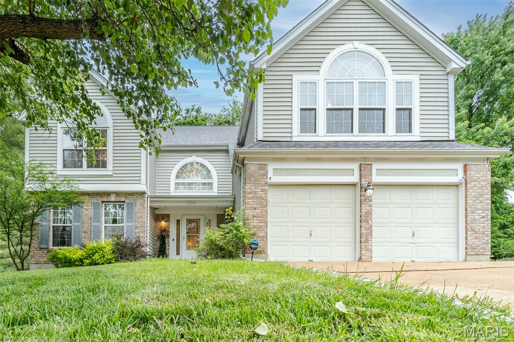 Welcome to this stunning classic 3,275 square foot Fisher & Frichtel two-story home! The grand two-story foyer opens into a warm and welcoming living room and dining area, highlighted by elegant crown molding and chair rails that add timeless character. The rooms are full of light and designed to flow seamlessly. The eat-in kitchen is open and functional. The warm cabinets provide plenty of storage space. The kitchen also has a built-in desk. The counter tops are a neutral color. Sliding glass doors lead out to the deck, which offers captivating views of nature's beauty. The kitchen opens up to a fabulous family room featuring a 6-baywindow, gas fireplace, and gorgeous custom bookcases surrounding the fireplace. On the second floor, you will discover a spacious loft. Bathed in natural light, an expansive window perfectly frames the wooded terrain, which provides a tranquil feel. Off of the loft area, you will find a luxurious Primary Suite, featuring a vaulted ceiling, walk-in closet and a secondary closet with sliding doors. The primary bath has a soaking tub, separate shower, and a large vanity. The second floor also has 2 bedrooms and 1 full bathroom. The bedrooms offer flexible use and can easily be converted into a home office, exercise room, or a creative studio to fit your lifestyle.  Additional  highlights  include  1st floor laundry, 2 car garage, ceiling fans, side yard for family fun.  Washer, dryer, freezer, and pool table are all included.