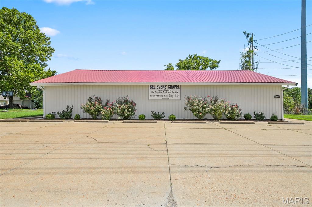 Great opportunity in a highly visible De Soto location! Currently used as a church, this approximately 2,400-square-foot freestanding building sits on a 0.91-acre site and offers a versatile, open layout. The spacious sanctuary and gathering area flows directly into the open kitchen, making the property well suited for worship services, fellowship and other gatherings. The building also includes two bathrooms and a small nursery. Paved parking in front, along with additional gravel parking, provides plenty of space for attendees and guests. A small shed offers convenient storage for lawn equipment and other outdoor items. Additional features include central air, public water and sewer, and two 200-amp electrical services. Conveniently located on State Road CC near Highway 67, the property offers excellent visibility and easy access. Ideal for continued use as a place of worship or potentially a variety of other uses. Buyer to verify zoning and suitability for the buyer’s intended use with the appropriate governing authority.